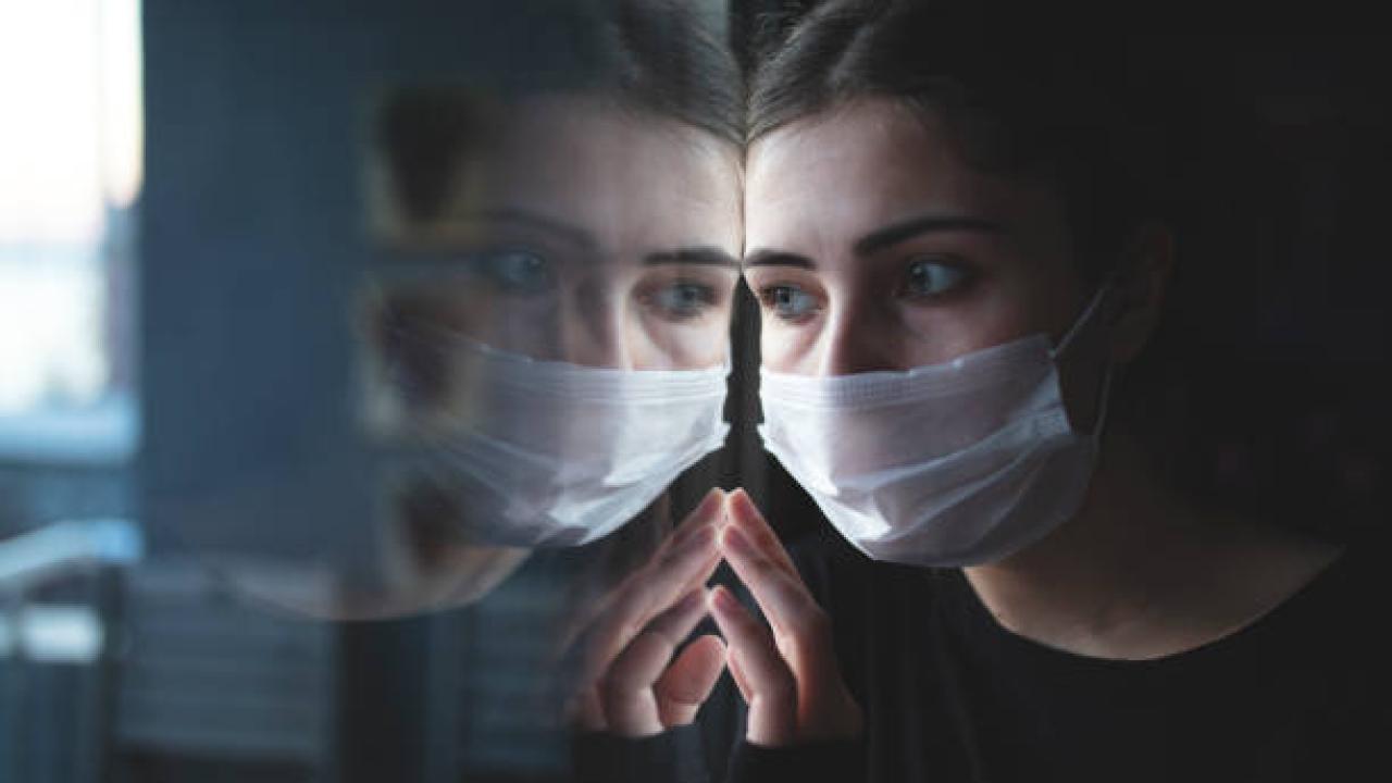 woman reflection with mask