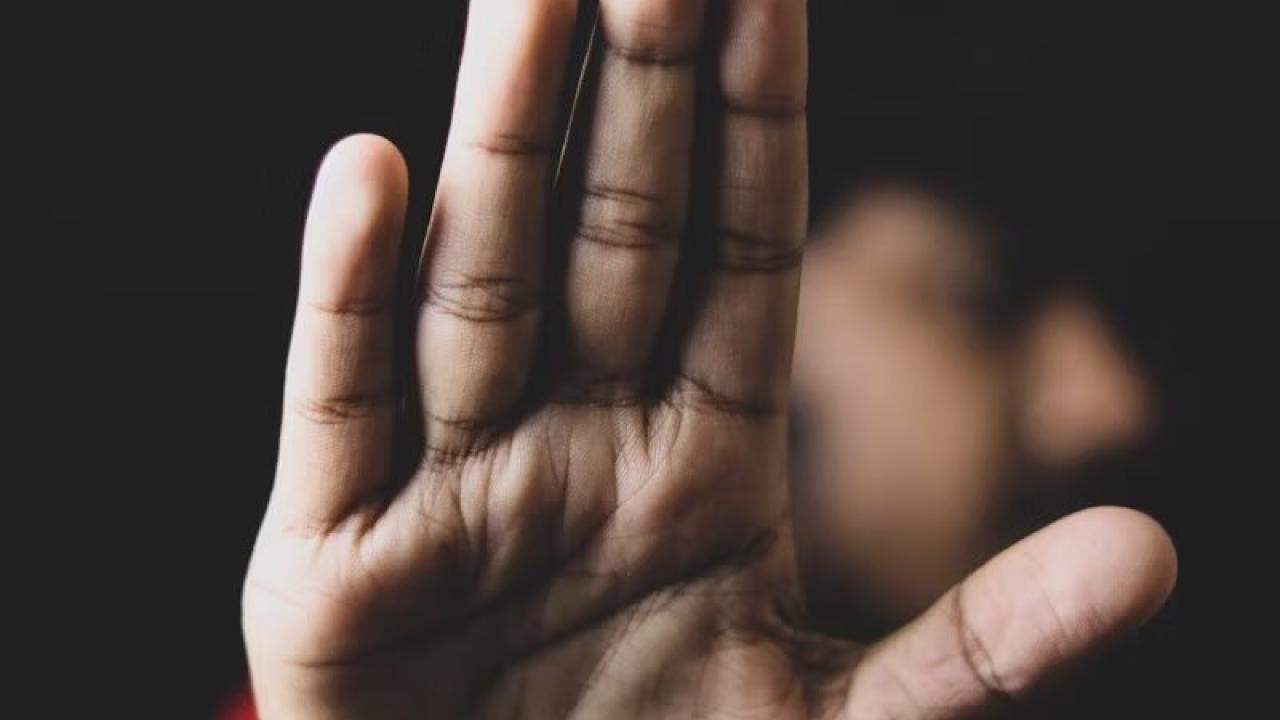 hand raised to say stop