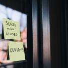 two sticky notes with closed covid-19